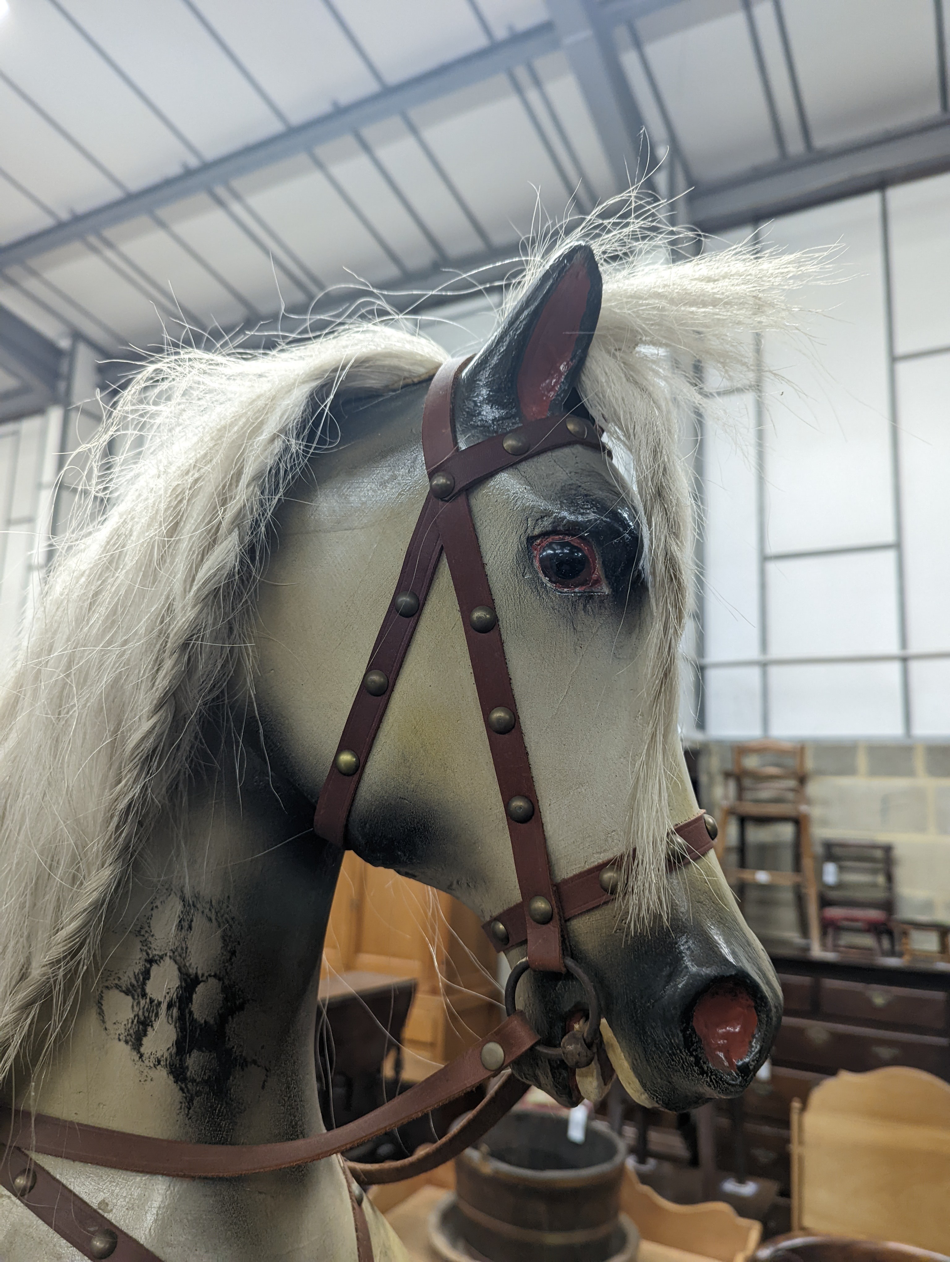 A large Victorian style painted rocking horse with end seats, length 240cm, height 132cm